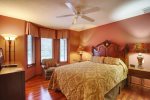 Queen guest room with window seat, seating, dresser, night stands